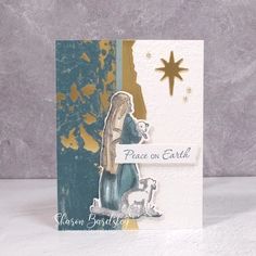 a christmas card with a nativity scene and star on the side that says peace on earth