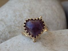 Gold Amethyst Ring, Heart Shaped Ring, Anniversary Gift for Wife Gift, Purple Gemstone Ring, February Birthstone Ring, Amethyst Heart RingGold filled Amethyst heart shaped ring, perfect anniversary gift for wife.Metal: 14K Gold FilledGemstone: AmethystSize: All US Sizes Heart Size: 13mm x 13mmThe ring will be packed in a gift box.FOR MY RINGS COLLECTION HERE:https://www.etsy.com/il-en/shop/rebekajewelry?section_id=14282915&ref=shopsection_leftnav_9TO GET TO MY SHOP:https://www.etsy.com/il-en Heirloom Heart Cut Gemstone Jewelry, Heirloom Heart-shaped Gemstone Ring, Elegant Amethyst Heart-shaped Birthstone Ring, Elegant Heart-shaped Amethyst Ring With Accent Stones, Fine Jewelry Heart-shaped Amethyst, Heart-shaped Amethyst Ring With Accent Stones, Heirloom Style Amethyst Ring As A Gift, Heirloom Heart Cut Gemstone Ring, Heirloom Style Amethyst Ring Gift