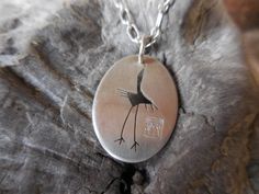 This hand-pierced sterling silver pendant is elegant and special in design as well as how it is made. The crane has been one of my favorite images to have on my work. When I first looked at the "meaning" of the crane it was self-knowledge and companionship. This is a perfect Ling-Yen design theme. Also, I found in Wikipedia, the added meaning that throughout Asia, the crane is a symbol of happiness and eternal youth. In Japan, the crane is one of the mystical or holy creatures and symbolizes goo Hand Piercing, Eternal Youth, Design Theme, My Favorite Image, Oval Pendant, The Meaning, Sterling Silver Pendant, Sterling Silver Pendants, Pendant Necklaces