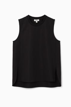 The tank top is a foundational part of any wardrobe. Made from a soft cotton-blend, this black one has side slits and a curved, stepped hem that adds shape to any outfit when left untucked. Regular fitSleeveless Shell: 61% Cotton, 23% Polyester, 16% Elastane. Excluding trims / Machine wash Back length of size S is 72cm / Model wears a size S Black Tank Muscle Tee For Layering, Black Muscle Tee Tank For Layering, Fitted Sleeveless Top With Side Slits, Chic Black Tank Top With Minimal Stretch, Culotte Shorts, Denim Sweater, Vest Shirt, Knitwear Cardigan, Dress Trousers