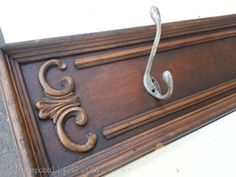 an antique drawer is repurposed into a coat rack