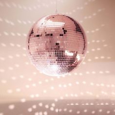 a shiny disco ball hanging from a ceiling