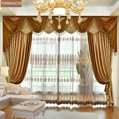 an elegant living room with gold curtains and chandelier