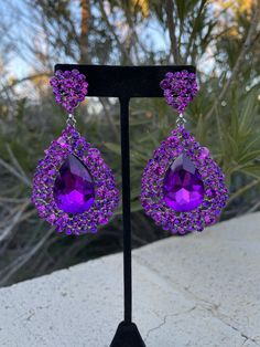 Purple Prom Earrings, Purple And Green Earrings, Purple Drop Crystal Earrings For Evening, Purple Crystal Drop Earrings For Evening, Elegant Purple Clip-on Earrings For Party, Glamorous Purple Drop Earrings, Glamorous Purple Jewelry For Evening, Purple Rhinestone Crystal Earrings For Party, Purple Rhinestone Drop Earrings