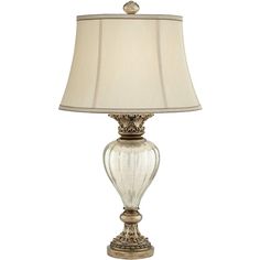 a lamp with a white shade on top of it and a beige lampshade