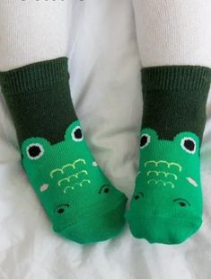 Make a splash with these snappy crocodile zoo socks, perfect for the little ones! With a playful and unique design, these socks bring a fun vibe to any outfit. Don't miss out on these jaw-some socks! 75% Cotton 23% Polyester 2% Spandex Sizes XS (0-18M), S (18M-3T) Anti-Slip Bottom Non-slip Cotton Socks For Playtime, Playful Non-slip Cotton Socks, Cotton Socks For Winter Playtime, Fun Green Cotton Socks, Green Casual Socks For Playtime, Casual Green Socks For Playtime, Fun Winter Non-slip Socks, Fun Non-slip Winter Socks, Fun Non-slip Socks For Playtime