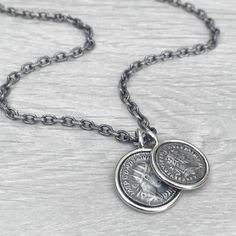 "Oxidised solid Sterling silver replica Roman coin circle framed pendants on a choice of spiga or round box chain - Men's jewellery To offer the chain variations for this item each chain length is made to order. Please allow up to 1 week for the item to be ready to post. Please check the shop announcement section for any current updates, potential disruptions and extra info regarding ordering. This can be found on the main shop page. An all over oxidised brushed finish with a polished silver frame. Solid Sterling silver pendant size - 23mm  (31mm long with jump ring) Solid Sterling silver pendant size - 21mm  (28mm long with jump ring) A choice of oxidised matt finish Sterling silver chain styles -  4.2mm wide filed trace chain - 20\", 22\", 24\", 26\", 28\" 2.5mm wide round box chain - 20 Roman Coins, Silver Chain Style, Round Box, Circle Frames, Chains For Men, Silver Frame, Box Chain, Sterling Silver Pendant, Chain Styles