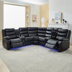 a living room with a large black sectional couch