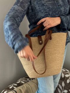 Beautiful and comfortable bag made of jute rope or cotton rope for choose. leather elements of black or marron colors.  This bag is original, comfortable and roomy. Can hold a whole list of things materials: Natural jute rope or cotton rope, leather.  Dimensions: Dimensions: bag height 26cm, top width 40-42cm. Completely handmade. Trendy Woven Jute Shoulder Bag, Braided Jute Bags, Trendy Braided Straw Bag For Travel, Brown Braided Bags For Beach Season, Trendy Bucket Jute Shoulder Bag, Trendy Jute Bucket Shoulder Bag, Trendy Braided Jute Beach Bag, Beige Braided Crochet Bag, Trendy Natural Braided Shoulder Bag