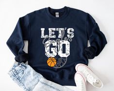 This custom basketball sweatshirt is soft and comfortable, perfect to keep you warm and cozy on basketball game day. Make this sweatshirt extra special by personalizing it with your favorite team name. HOW TO ORDER: Please leave the team or mascot name in the "Add your personalization" text box.  I can also add a player's number on the basketball in black.   Please message me if you have any questions before ordering. This UNISEX FIT sweatshirt will last for years. Good quality material that nee Basketball Mom Shirts, Basketball Sweatshirts, Team Sweatshirts, Personalized Basketball, Basketball Tees, Custom Basketball, Take Home Outfit, Basketball Mom, Basketball Game