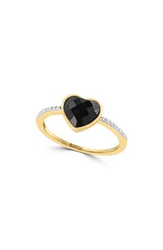 A black onyx heart centers a romantic 14-karat yellow-gold ring finished with a diamond-embellished band for dainty sparkle. 1/4" band width Total onyx weight: 0.85ct. Total diamond weight: 0.06ct. Color: H–I Clarity: I2 14k gold/onyx/diamond Made in the USA Diamond Guide Black Ring For Valentine's Day Formal Occasion, Black Rings For Valentine's Day Formal Occasion, Black Rings For Valentine's Day Formal Events, Black Diamond Jewelry For Valentine's Day, Black Diamond Heart-shaped Jewelry, Black Heart-shaped Diamond Jewelry, Elegant Black Heart Ring For Weddings, Valentine's Day Black Diamond Jewelry, Black Heart Cut Rings For Valentine's Day