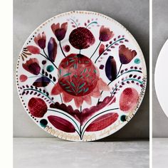 two plates with different designs on them, one is white and the other is red