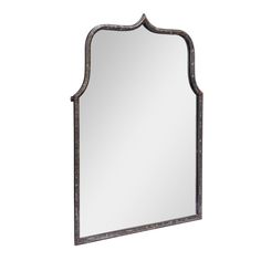 a mirror that is sitting on top of a wall with a metal frame and wood trimming