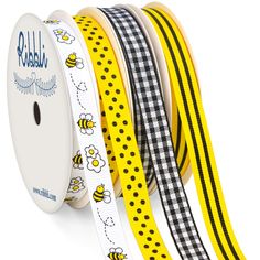 four rolls of yellow and black checkered ribbon with bees on the front, one roll is