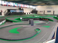 an indoor miniature racing track in a building