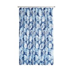 a blue and white shower curtain hanging from a metal rod with an abstract design on it