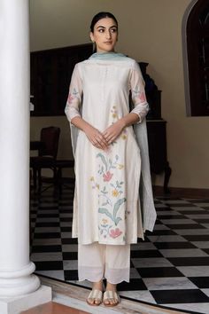 Buy Off White 100% Linen Embroidery Floral V Neck Corsage Kurta Pant Set For Women by Kaveri Online at Aza Fashions. White Silk Lawn Suit For Spring, White Silk Lawn Suit With Floral Embroidery, Elegant White Unstitched Suit For Spring, Wedding Pants For Eid With Floral Embroidery, White Embroidered Silk Lawn Suit, Traditional White Pants For Wedding, White Silk Lawn Suit With Traditional Drape, White Cotton Silk Salwar Kameez For Spring, White Sharara With Intricate Embroidery For Spring