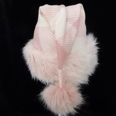 "This festive Santa hat is made up in a pastel pink gingham check fleece fabric. The fabric is a soft quality poly fleece fabric, cozy and warm. So if you plan on wearing it in the winter outdoors this is a good choice. The hat is accented with a long pile soft pink faux fur fabric trim. Proportions of the hat are generous and will fit most head sizes, ladies or gents. The styling is a slouch cone, traditional Santa look. Measurement for opening for your head is 25\" circumference and the length Cozy Warm Pink Hats, Warm Cozy Pink Hat, Cozy Pink Winter Hat, Pink Winter Bonnet One Size, Pink One-size Bonnet For Winter, Pink Winter Bonnet Cap, Pink Warm Bonnet One Size, Warm Pink Bonnet, One Size Fits Most, Warm Pink Bonnet One Size Fits Most