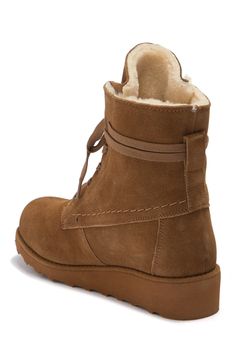 A stylish take on a cozy lace-up boot constructed from a soft suede or wool with genuine shearling lining to keep you warm and NeverWet water and stain resistant coating for preservation throughout the seasons.Sizing: Whole sizes only; for 1/2 sizes, order next size up. M=standard width - Round toe- Suede(black, hickory li) or wool(grey) construction - Topstitched and wrap around detail- NeverWet water resistant and stain resistant coating- Genuine shearling lining- Lace-up- Lightly padded insol Brown Suede Lace-up Hiking Boots, Lace-up Winter Boots With Suede Lining, Winter Suede Desert Boots With Suede Lining, Brown Shearling Boots With Suede Lining, Rugged Suede Desert Boots For Winter, Winter Suede Lace-up Boots, Brown Winter Lace-up Boots With Suede Lining, Brown Suede Lace-up Boots For Winter, Brown Lace-up Boots With Suede Lining For Winter