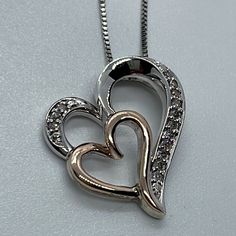 Lovely Sterling Silver 18.5” Long Chain Featuring A Pendant With 2 Hearts Sterling Silver And 14k Rose Gold. The Large Sterling Silver Heart Has 14 Round Shape Natural Diamonds (1/10 Ct. T.W.) It Weights Approximately 4.35 Grams. In New Condition With Box And Pouch. Elegant Pearl Jewelry, Southwestern Necklace, Rose Gold Pendant Necklace, Gold Locket Necklace, 2 Hearts, Chunky Bead Necklaces, Pearl Necklace Vintage, Rhinestone Statement Necklace, Pearl Jewelry Necklace