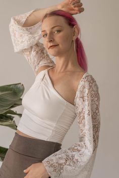 Take a plain top or dress to the next level with a unique lace sleeve shrug! The stretch in the back makes this a large to an extra large. Lace Shrug Outfit, Fitted Off-shoulder Top With Built-in Bra, Stretch Lace Long Sleeve Crop Top, Stretch Long Sleeve Lace Top, Elegant Stretch Lace Crop Top, Stretch Long Sleeve Lace Top For Summer, Stretch Lace Long Sleeve Top, Stretch Crop Top With Sheer Sleeves For Spring, Fitted Blouse With Lace Sleeves For Spring