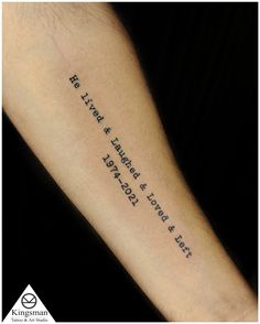 a person with a tattoo on their arm that says, he lives and there is no end