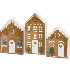 three wooden gingerbread houses decorated with christmas decorations