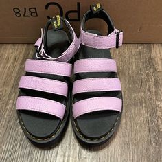 Dr Martens Blaire Sandals Women Size 8 Us/6uk Color: Lilac Pisa Brand New, Never Worn. But I Threw Away The Original Box But I’d Put Them In A Shoe Box When I Shipped The Item. Pisa Is A Medium-Weight Milled Nappa Leather With A Soft Tumbled Handle And Richly Pigmented Waxy Finish Our Zebrilus Sole Is Built From A Super-Lightweight Eva Material With A Rugged Ripple Tread. Goodyear Welted And Stacked At 1 7/8 Inch, For All-Day Comfort, Stability And Attitude Our Softwair Memory Foam Footbed Ensur Purple Flat Leather Sandals, Pink Leather Strap Sandals, Pink Round Toe Strap Sandals, Pink Round Toe Sandals With Straps, Pink Sandals With Ankle Strap And Branded Insole, Purple Sandals With Buckle Closure And Round Toe, Pink Double Strap Sandals For Spring, Dr Martens Blaire Sandal, Dr Martens Blaire