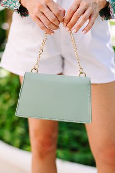 This petite purse is the perfect accessory for the fashion-forward individual. Crafted with minimalist chic in mind, this mint green purse will elevate any outfit with an element of tasteful luxury. The small bag is both perfected and timeless, allowing you to effortlessly accessorize any ensemble. Green Shoulder Bag For Formal Spring Occasions, Chic Green Shoulder Bag, Chic Green Clutch For Daily Use, Chic Green Rectangular Clutch, Chic Green Clutch For Everyday, Green Purse Outfit, Mint Green Purse, Spring Break Cruise, Sunglasses Necklace