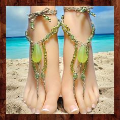 One-of-a-kind barefoot sandals are made from polished hemp with spring green glass beads and gold-colored metal beads. The large center beads are made of frosted resin. These sandals have 15-inch long ties that wrap around the ankle and can be adjusted to fit all adult sizes.  These woven barefoot sandals are one-of-a kind and the photos are of the exact item for sale.  They are designed to be adjustable to fit most adults with long ties that may be tied behind the heel or wrapped around the ank Handmade Green Sandals For Summer, Bohemian Round Beads Anklets For Beach, Adjustable Beaded Chain Anklets For Summer, Green Bohemian Open Toe Sandals, Adjustable Beaded Barefoot Sandals For Party, Bohemian Anklets With Round Beads For Beach Season, Summer Beaded Gold Anklets, Bohemian Beaded Anklets For Beach, Beaded Jewelry For Beach Season Parties