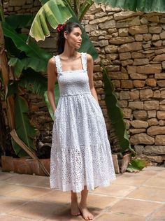 The Kristen Dress brings a fresh twist to effortless style with an airy, partially lined silhouette in embroidered cotton eyelet. Its tiered midi design flows beautifully, with a lining that stops at the knee, leaving the hem sheer for a touch of softness and sophistication. Just slip it on, and you’re instantly ready for everything from beachside brunches to evening strolls. Featuring a smocked bodice and straps, this dress is as comfortable as it is striking. The lace-trimmed tiers and flounce Summer Broderie Anglaise Tiered Skirt Dresses, Summer Dresses With Broderie Anglaise And Tiered Skirt, Summer Tiered Broderie Anglaise Dresses, Summer Broderie Anglaise Tiered Dress, Casual White Broderie Anglaise Midi Dress, White Casual Broderie Anglaise Midi Dress, Brunch Midi Dress With Broderie Anglaise, Broderie Anglaise Midi Dress For Brunch, Brunch Broderie Anglaise Midi Dress