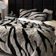 a zebra print bed spread in a bedroom