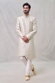 Light beige sherwani with thread embroidery. Paired with cream churidar. - Aza Fashions Ceremonial Semi-stitched Chanderi Sherwani, Cream Semi-stitched Sherwani With Pallu, Elegant Semi-stitched Chinon Sherwani, Semi-stitched Cream Sherwani With Intricate Embroidery, Luxury Cream Semi-stitched Sherwani, Churidar, Silk Embroidery, Mandarin Collar, Light Beige