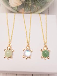 This Gold Sea Turtle charm necklace  is the perfect addition to your outfit! The product is made of high-quality 925 gold chain. These necklace will come in a beautiful packaging, so you can choose this as a gift for someone special. ♥ If you have any problem or question, please feel free to ask us; we are quick to respond https://www.etsy.com/ca/messages/new?to_username=ImagineJewelryGifts Explore for more, https://www.etsy.com/ca/shop/ImagineJewelryGifts Thanks for visiting my store and remember that anything is possible with a little imagination! Cute Turtle, Tout Est Possible, Green Turtle, Turtle Charm, Ocean Jewelry, Turtle Necklace, Cute Turtles, Turtle Pendant, Beautiful Packaging