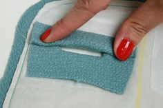 a woman's nails are being painted red on her manicured nail polishing