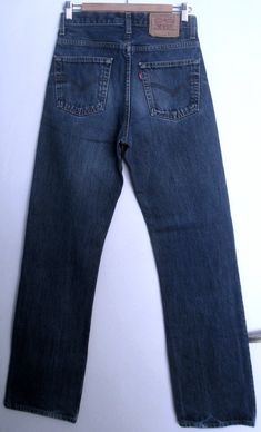 Vintage dark blue Levi's jeans with a high waist and a zipper and a button closure, from the 1990s era Material - cotton Size - marked 31*, but fit like 28 (will fit a 28 inch waist) *This is the vintage size on the label, which does not correspond to contemporary standards, vintage denim tends to be smaller than contemporary denim. Please look at measurements below and compare them to jeans you own: Approx. Measurements (taken with jeans lying flat. Double waist and hips ) Waist (double that): 90s Style Dark Wash Straight Leg Pants, 90s Style Full Length Denim Blue Jeans, 90s Style Dark Wash Denim Jeans, 90s Style Denim Jeans With Belt Loops, Hipster Jeans, 28 Inch Waist, Dark Blue Denim Jeans, 90s Jeans, 501 Jeans