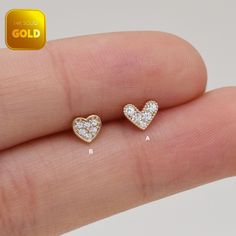 Metal: 14k solid gold, Available Gold color: Yellow gold  Guaranteed Authentic :14k Solid Gold，Not Gold Plated or Gold Filled Stone:  CZ Thickness:0.82mm (20G) Stamp:14k ★Every ear is different, the length of backings that most suitable for your ear will depend on your ear thickness ★Titanium is a very safe metal, so we don't plate it, in order to avoid some people are allergic to the plating material. NOTE The item combined by 14k solid gold and implant grade titanium push in back,  packed in a beautiful Jewelry Box   SHIPPING ADDRESS All the orders will ship to the supplied address through your Etsy Order, Please leave your phone number,will give to carrier for safe deliver. We will not send and replacement parcels due to incomplete or inaccurate address.  PACKING ●Can be Gift packed inc Gold Heart Earrings In Minimalist Style, Gold Heart-shaped Hypoallergenic Jewelry, Dainty Tiny Gold Heart Earrings, Heart-shaped Cartilage Earrings For Gift, Single Gold Dainty Heart Earring, Gold Plated Piercings As Gift, Gold Heart Earrings For Valentine's Day, Gold Heart-shaped Elegant Piercings, Dainty Gold Heart Single Earring