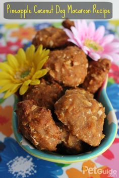 pineapple coconut dog macaron recipe in a bowl with flowers on the side