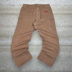 Vintage Dickies Carpenter Pants Camel Tan Canvas Baggy Fit Dungarees Work Wear Painters 90s Skate / Streetwear Great Condition: 9/10 Men's Size:  Waist: 40" Length (inseam): 32" Leg Opening: 9" Thigh Opening: 14" Front Rise: 15" 90s Oversized Wide Leg Bottoms, 90s Style Oversized Wide Leg Bottoms, Oversized Wide Leg 90s Bottoms, Vintage Oversized Straight Leg Bottoms, Vintage Oversized Wide Leg Bottoms, 90s Style Bottoms With Pockets For Fall, Casual Brown Work Pants For Streetwear, Baggy Brown Vintage Bottoms, Vintage Baggy Brown Bottoms