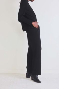 Crafted with precision and attention to detail, these pants boast a tailored silhouette that flatters all body types. The plisse pleats cascade down the fabric, offering a luxurious feel and a dynamic visual appeal that effortlessly catches the eye. A-Line shape Ribbed fabric Loose fit Short sleeves Fitted Wide-leg Ribbed Pants, Fitted Ribbed Wide-leg Pants, Black Pleated Bottoms For Workwear, Black Pleated Pants For Work, Elegant Ribbed Pants For Fall, Ribbed Wide-leg Workwear Pants, Ribbed Wide-leg Pants For Work, Stretch Ribbed Pants For Work, Elegant Stretch Ribbed Pants