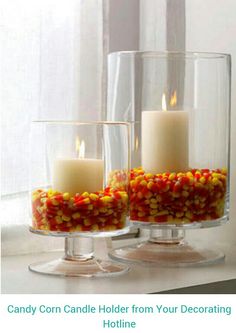 two glass vases filled with candy corn