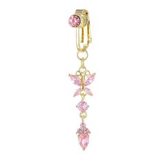 a gold charm with pink crystals hanging from it