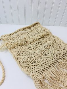 "Vintage macrame purse. Wonderful hippie boho style. This is really from the 1970s, perfect for the vintage lover! Very clean. Size is : 15\" long with fringe x 10\" wide. Total length with strap is 30\"." Beige Macrame Crochet Shoulder Bag, Beige Crochet Shoulder Bag With Macrame, Beige Crochet Macrame Shoulder Bag, Macrame Crossbody Bag For Beach, Vintage Crochet Shoulder Bag For Beach, Bohemian Cream Crochet Crossbody Bag, Vintage Crochet Shoulder Bag For The Beach, Bohemian Beige Fringe Shoulder Bag, Bohemian Cream Woven Bag