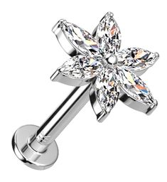 a flower shaped piercing with crystal stones in the center