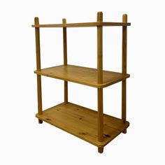 a wooden shelf with three shelves on it