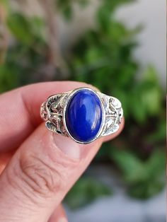 Natural Lapis lazuli Oval 925 Sterling Solid Silver Handmade Ring for Girls / Women. Product Details: Gemstone: Lapis lazuli Stone Color: Blue Stone Shape: Oval Cabochon Stone size : 11 x 9 mm Stone Polish: High Ring Size: All US Size Available from 4 to 14 Metal: 925 Solid Sterling Silver Purity: 925 Parts Per 1000 Stand out of the crowd with this lovely natural Lapis lazuli ring on your finger.  This elegant handmade ring design is simple and eye-catching.  The Blue color of the gemstone is su Handmade Adjustable Lapis Lazuli Rings, Elvish Style Silver Ring For Gift, Bohemian Sapphire Rings For Gifts, Bohemian Sapphire Ring As A Gift, Bohemian Sapphire Ring For Gift, Handmade Blue Jewelry For Promise, Handmade Blue Jewelry For Promise Occasions, Handmade Lapis Lazuli Rings Perfect For Gifts, Adjustable Spiritual Sapphire Ring As Gift