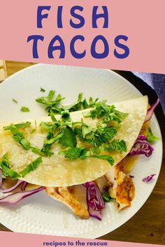 fish tacos on a white plate with red onions and cilantro