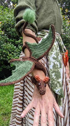 a close up of a person's hand wearing a costume