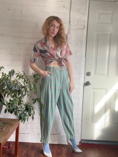 Love the cut and feel of these leisure pants! You won't want to take them off.  Oh-so-soft cotton weave in pretty muted green & pink plaid. Pleated high waist and draped tapered leg.  Sophisticated jams. Super comfy yet refined. Waistband elasticated at sides. Inset side pockets. 1 1/2" Belt loops. Front zip fly / button closure. by Vaurent France, "Its a Vaurent  day, today". Excellent condition. Waist 28" - 32" Hips 44" Rise 13 1/2" Inseam 27" Length 39" Thigh 26" Marked Size 12 Fits M / L Indian Pants, Tango Pants, France Vintage, Muted Green, Pants Sewing Pattern, Womens Trousers, Turkish Fashion, Linen Pants Women, Sewing Pattern Sizes