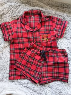 Nothing says Christmas quite like this red tartan print, perfect for festive family pyjamas. Our 'Comfort and Joy' Christmas pyjama range is made from 100% brushed cotton, making them cool and soft for the whole family. Men's, children's and baby's versions available so the whole family can match.  *100% brushed cotton *Button up, two-piece set *Navy blue trim *Comfort and joy embroidered pocket *Matching family sets available Cute Womens Christmas Pajamas, Christmas Pajamas Set, Christmas Pjs Aesthetic Family, Plaid Cotton Loungewear Sets, Plaid Cotton Sleep Sets, Plaid Cotton Sleepwear Sets, Plaid Cotton Sleepover Sets, Plaid Cotton Sets For Sleepover, Christmas Pjamamas